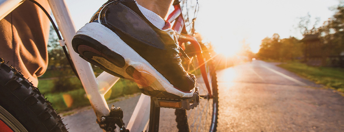 A stock image of someone peddling a bicycle.