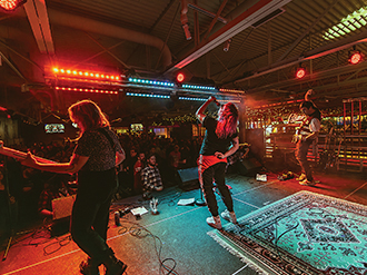 A photo of a band playing on stage at Palasad Social Bowl.