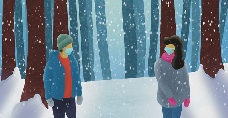 A man and a woman walking at a distance through a snowy forest